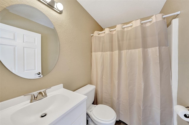 bathroom featuring a shower with shower curtain, vanity, toilet, and lofted ceiling