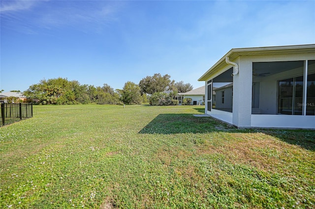 view of yard with a sunroom