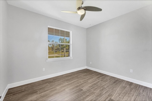 spare room with hardwood / wood-style flooring and ceiling fan