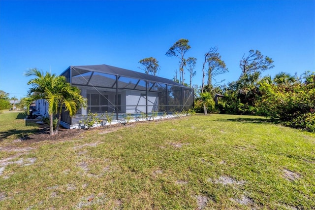 view of yard featuring glass enclosure