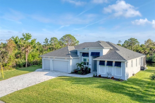 view of front facade featuring covered porch, a front yard, and a garage