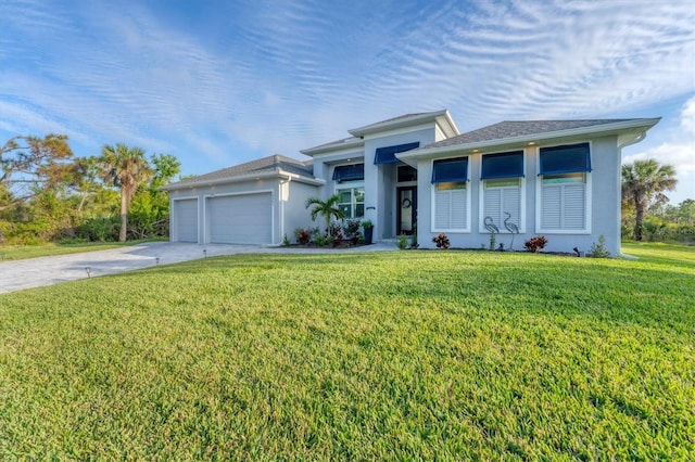 view of front of home with a garage and a front yard