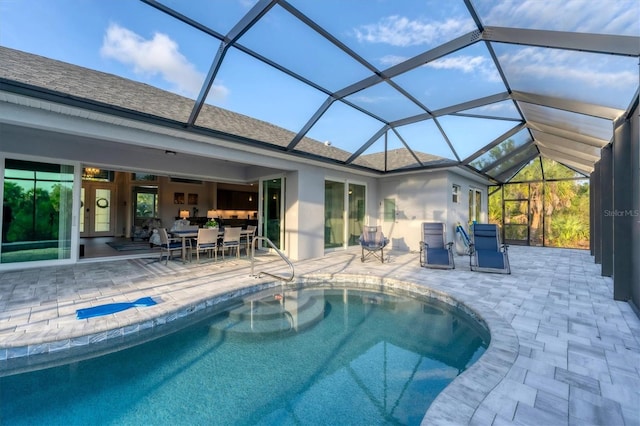 view of pool featuring a lanai and a patio