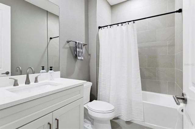 full bathroom featuring shower / bath combo, vanity, and toilet