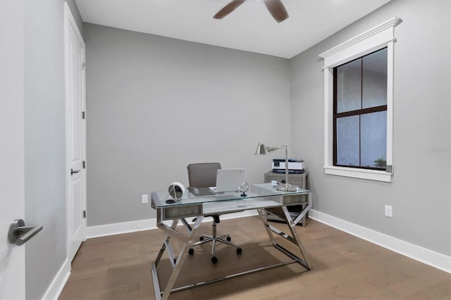 office space with hardwood / wood-style floors and ceiling fan