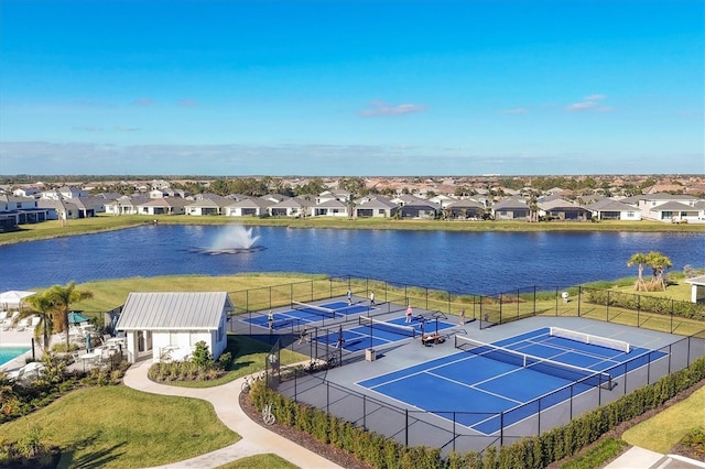 birds eye view of property with a water view