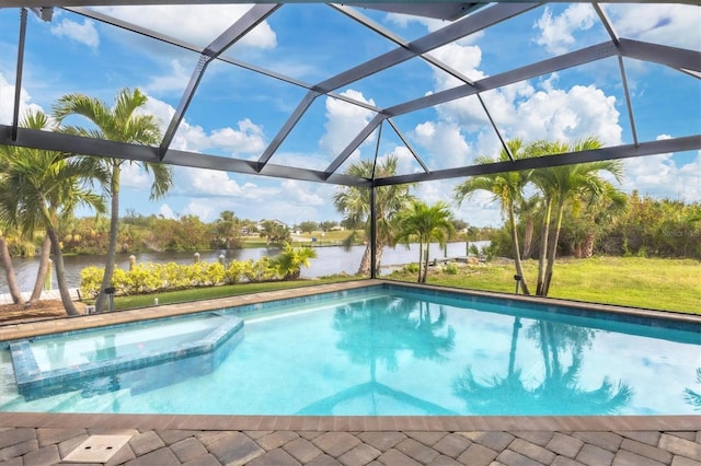 view of pool featuring glass enclosure and a water view