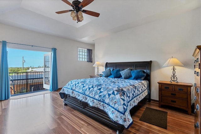 bedroom with access to outside, ceiling fan, and hardwood / wood-style flooring