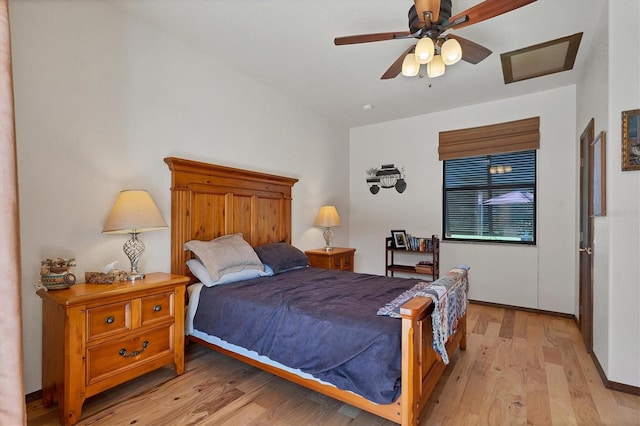 bedroom with light hardwood / wood-style flooring and ceiling fan