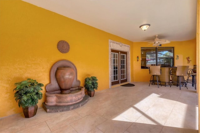 view of patio with a bar and ceiling fan