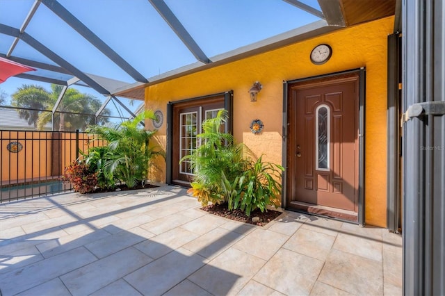 doorway to property featuring a patio