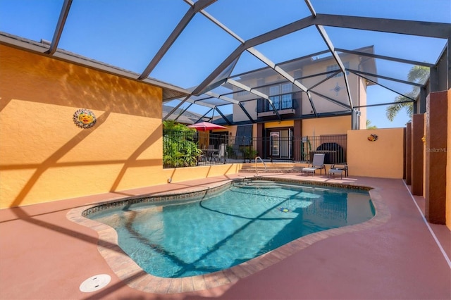 view of pool featuring a lanai and a patio