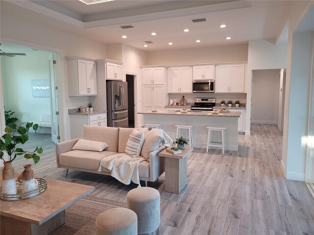 14331 Montmarte Ave, Port Charlotte, FL 33981 - living area featuring light wood finished floors, recessed lighting, and baseboards
