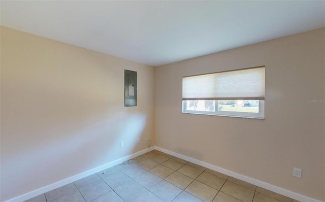 tiled spare room with electric panel