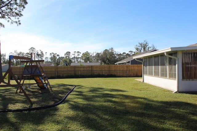 view of yard featuring a sunroom