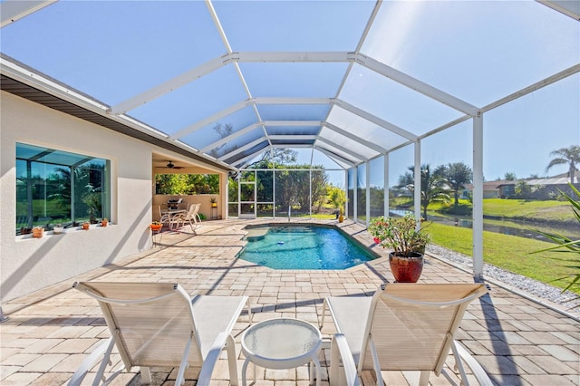 view of pool featuring a lanai, a patio area, and ceiling fan