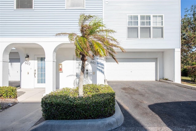 view of exterior entry featuring a garage