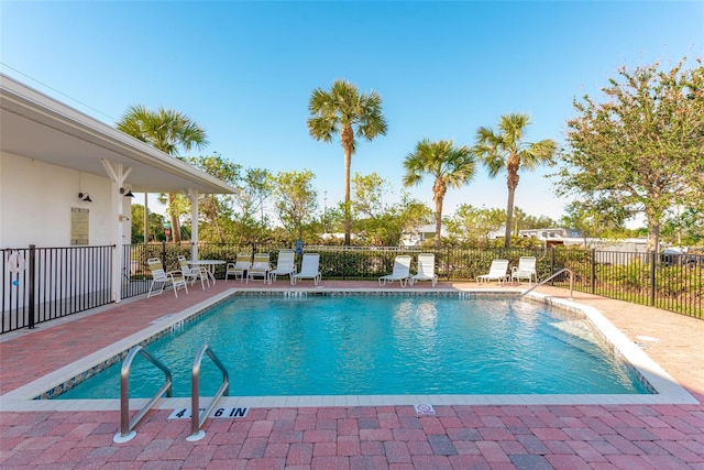 view of swimming pool featuring a patio area