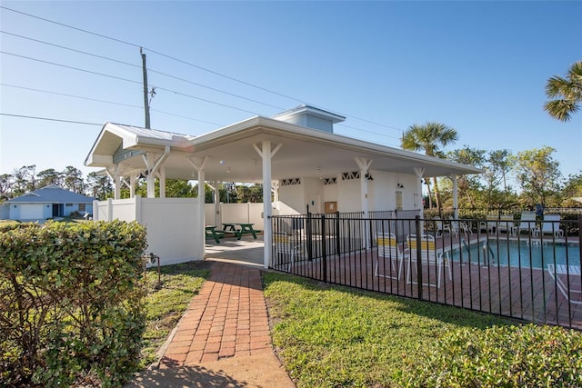 exterior space with a patio area and a pool