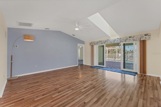 unfurnished living room featuring wood-type flooring, ceiling fan, and lofted ceiling