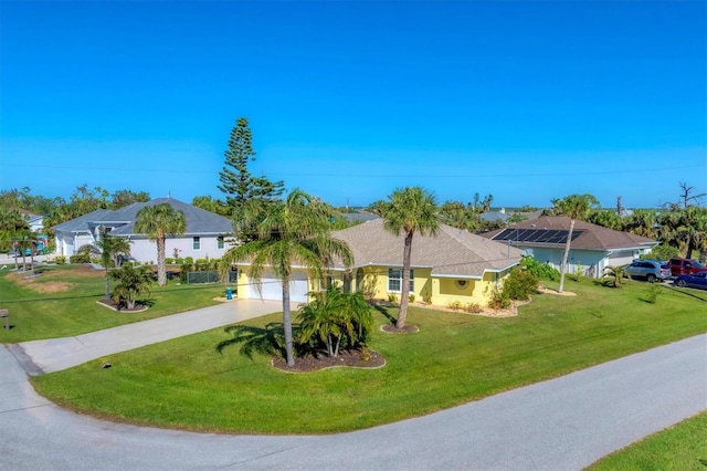 single story home featuring a front yard and a garage