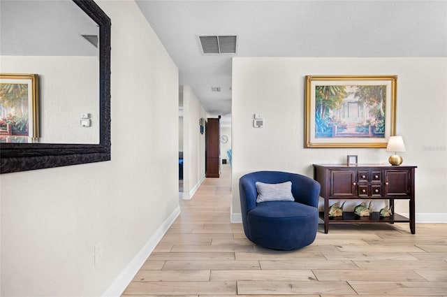 hall with light hardwood / wood-style flooring