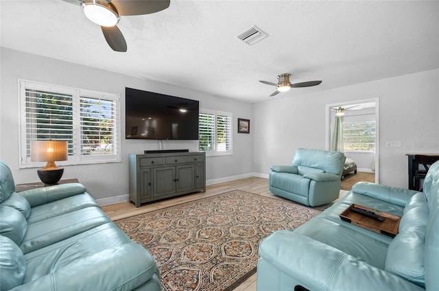 living room with a healthy amount of sunlight and light wood-type flooring