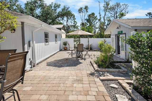 view of patio / terrace with an outbuilding