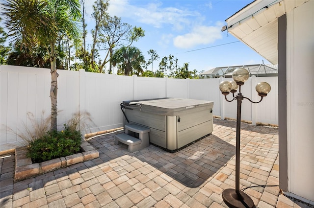 view of patio with a hot tub