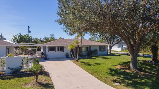 ranch-style home featuring a front yard