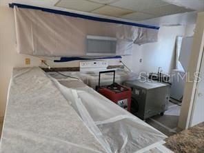 kitchen featuring a paneled ceiling