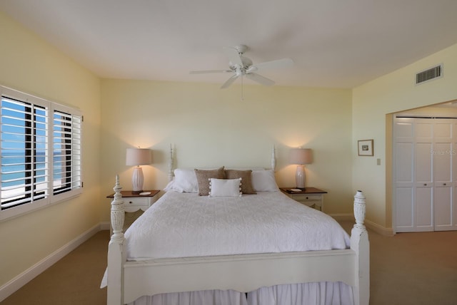 bedroom featuring carpet flooring, ceiling fan, and a closet