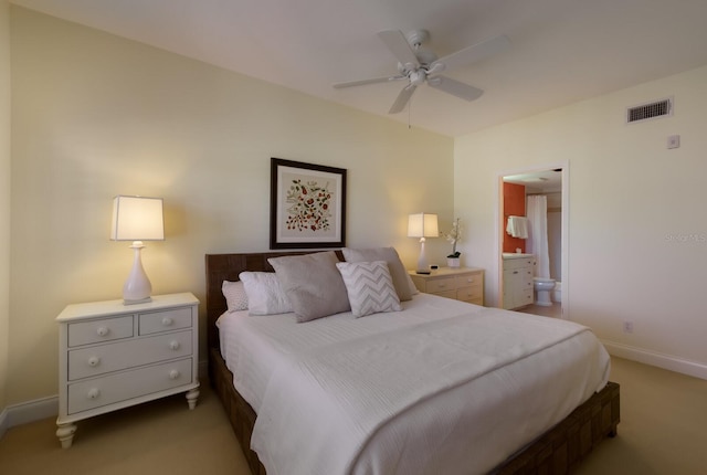 bedroom featuring carpet flooring, ensuite bathroom, and ceiling fan