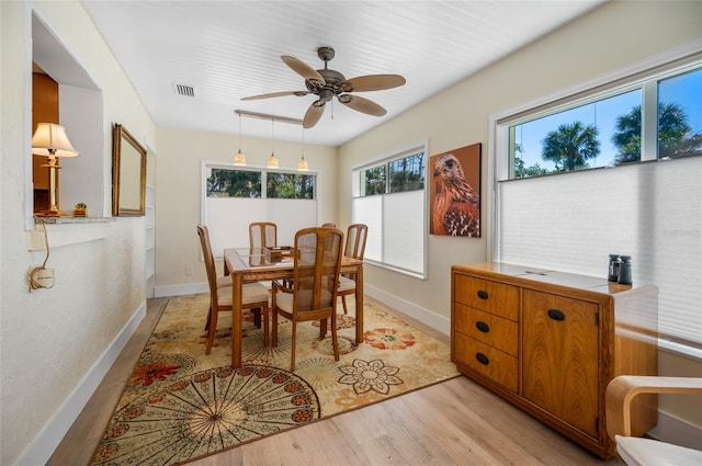 dining space featuring ceiling fan and light hardwood / wood-style flooring