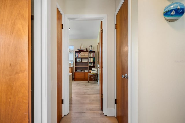 corridor with light wood-type flooring