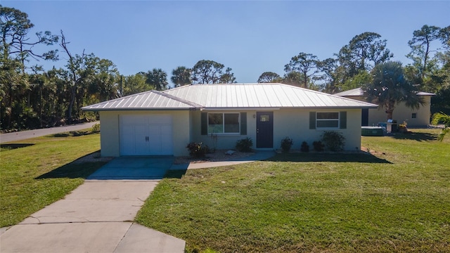 single story home featuring a garage and a front lawn