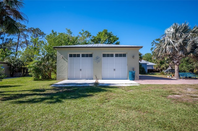 garage with a yard