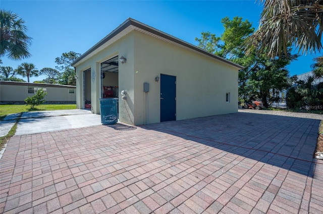 view of side of home with a patio