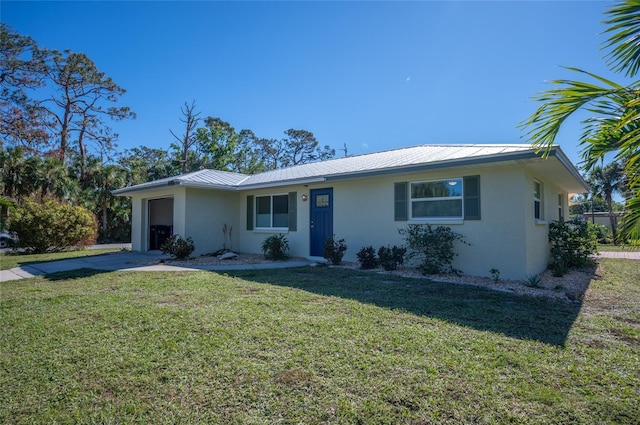 ranch-style home with a garage and a front yard