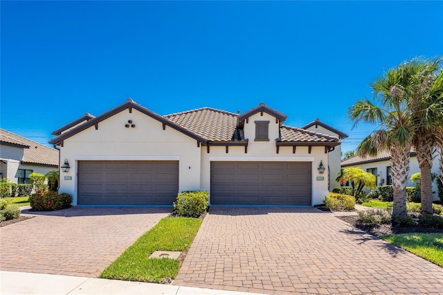 mediterranean / spanish house featuring a garage