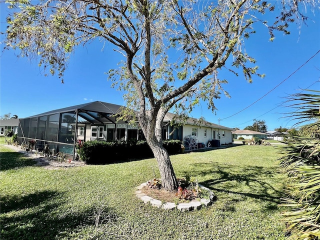 view of yard featuring glass enclosure