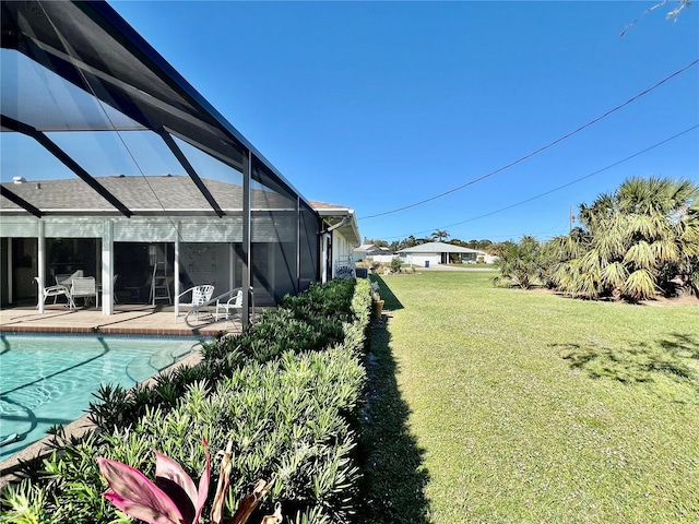 view of yard with a patio and a lanai