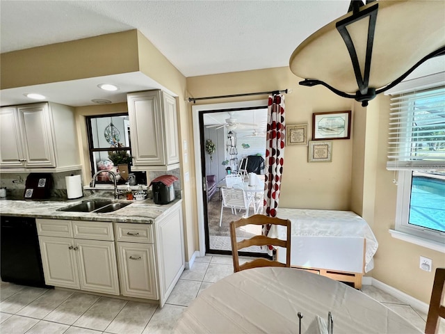 kitchen with dishwasher, backsplash, sink, ceiling fan, and light tile patterned floors