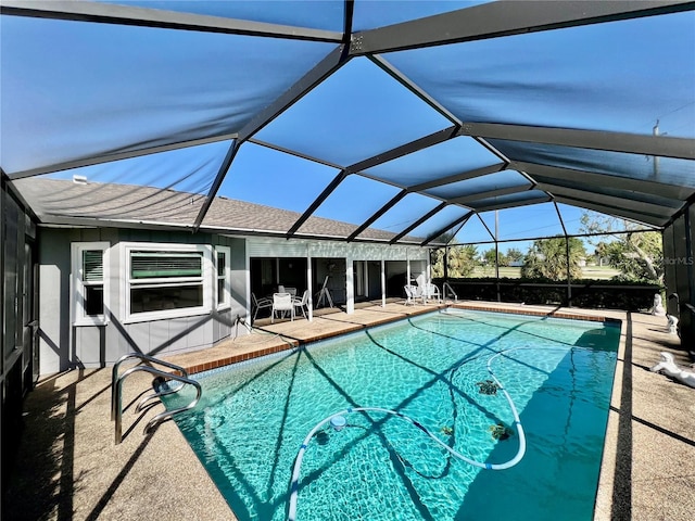 view of pool featuring a lanai and a patio