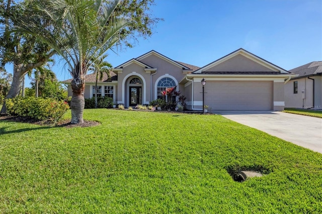 ranch-style home with a front yard and a garage