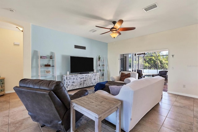 living room featuring ceiling fan and light tile patterned flooring