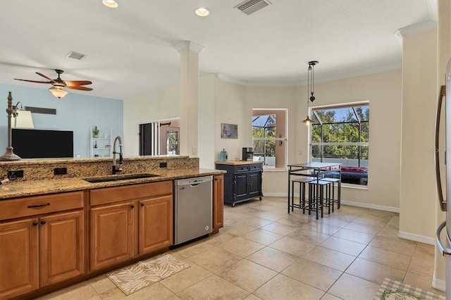 kitchen featuring dishwasher, sink, ceiling fan, light stone countertops, and ornamental molding