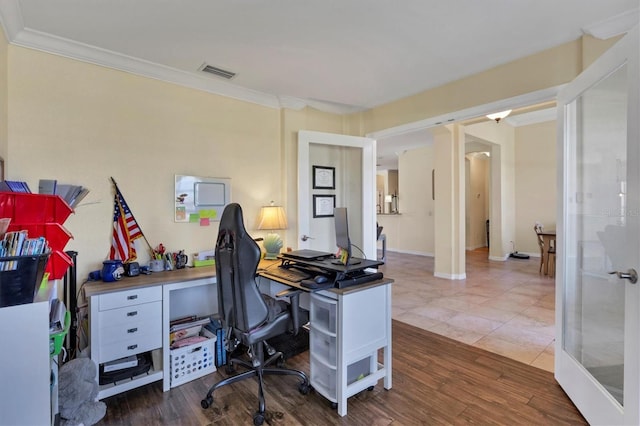 office with dark hardwood / wood-style flooring, french doors, and ornamental molding