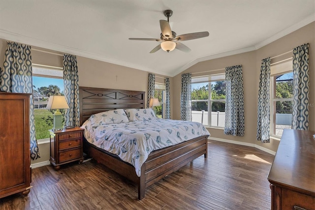 bedroom with multiple windows, ceiling fan, dark wood-type flooring, and vaulted ceiling