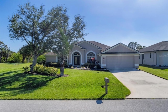 ranch-style house featuring a front lawn and a garage